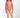 Young girl wearing a pink patterned swimsuit on a white background