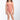 Young girl wearing a pink patterned swimsuit on a white background