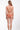 Person wearing a peach-colored bikini on a white background