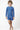 Child wearing a blue patterned swimsuit on a white background