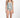 Woman wearing a light green swimsuit with a white background