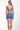 Woman wearing a blue patterned bikini set on a white background