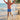 Child playing on a beach with palm trees in the background